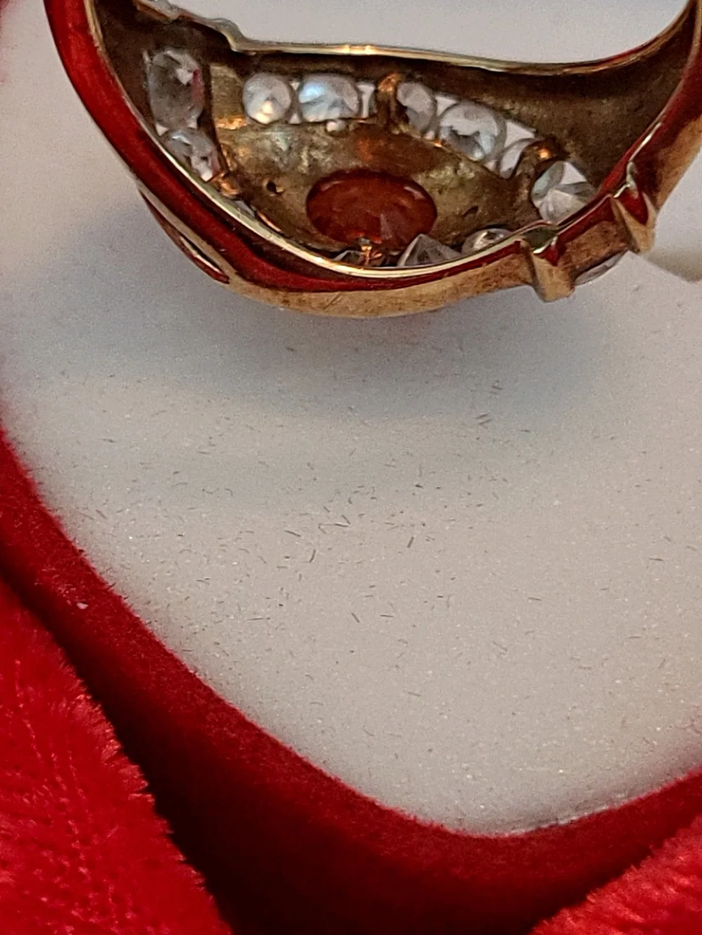 1.25ct. Spessartite Garnet Surrounded By 14 Sparkling Diamonds!